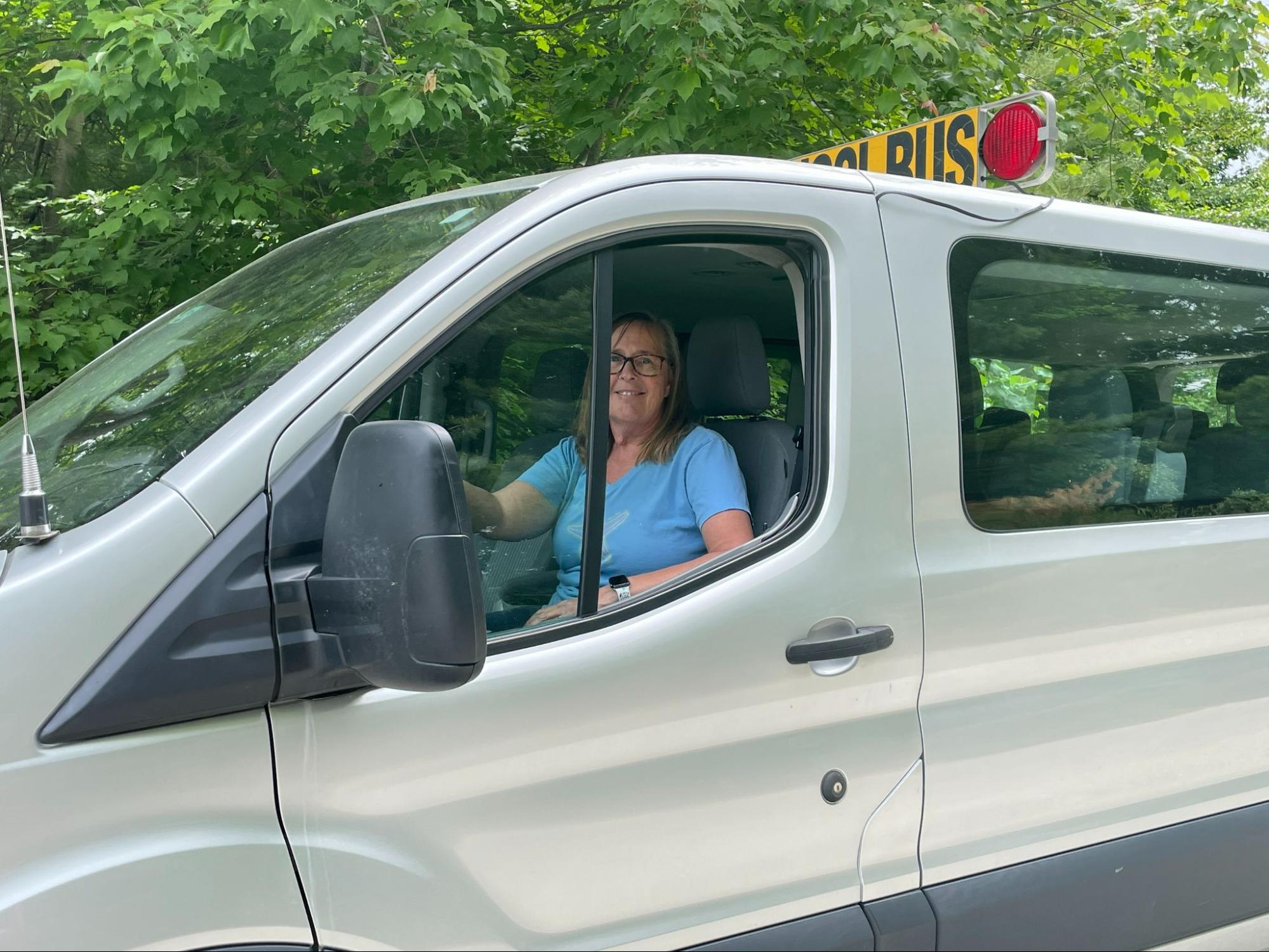 Student boarding a specialized transportation van providing services for students with an Individualized Education Program in Massachusetts operated by Van Pool Transportation