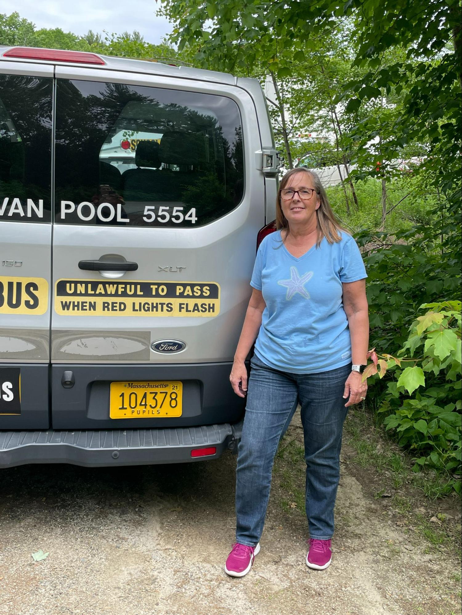 School transportation van providing student transportation services for schools across Massachusetts operated by Van Pool Transportation ensuring safe and reliable daily travel