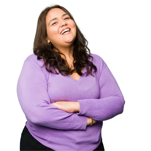 a smiling woman with her arms crossed