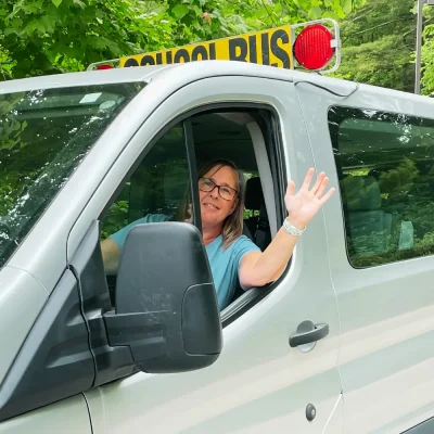 a driver waving out of the window